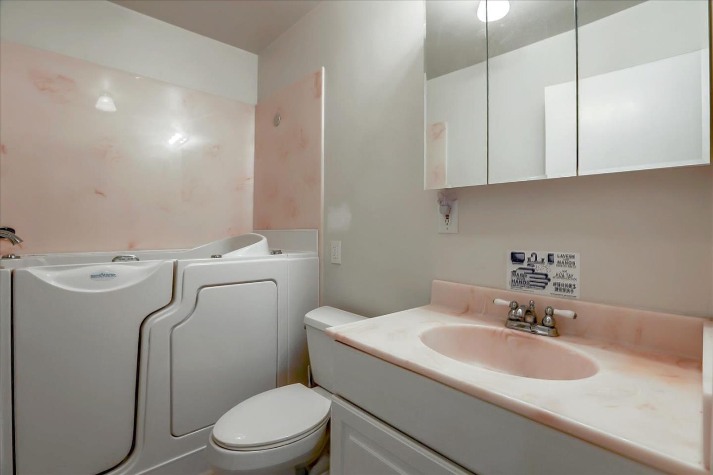 10150 Clayton Road San Jose, CA 95127 - Photo 20 of 61 a bathroom with a sink a toilet and a mirror