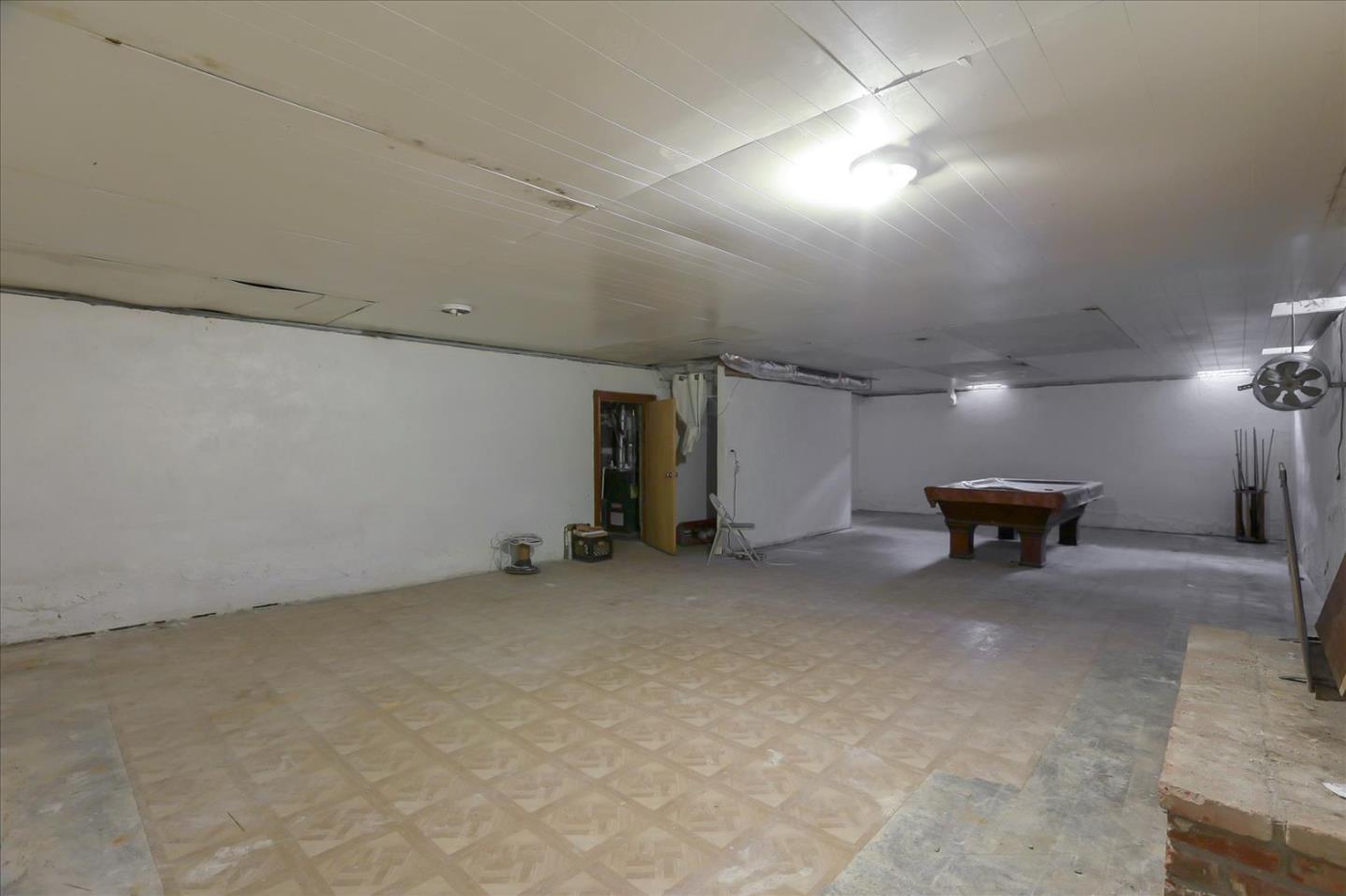 10150 Clayton Road San Jose, CA 95127 - Photo 26 of 61 an empty room with furniture and a chandelier