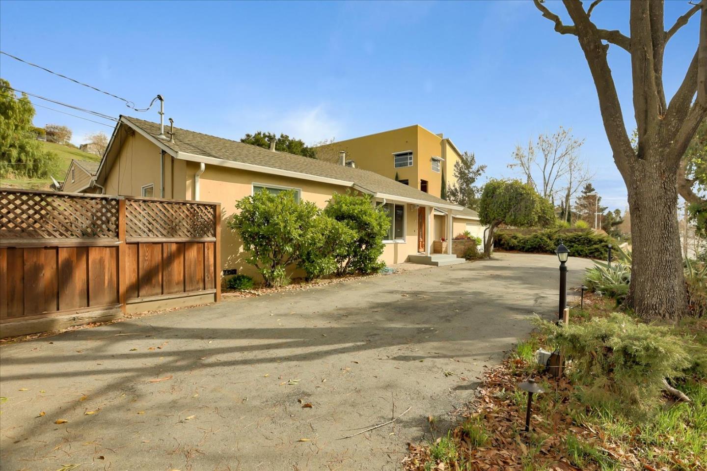 10150 Clayton Road San Jose, CA 95127 - Photo 56 of 61 a view of a house with a tree in the background