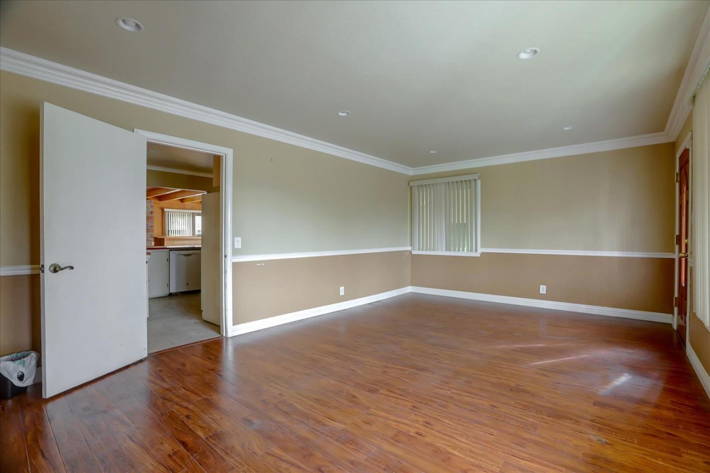 10150 Clayton Road San Jose, CA 95127 - Photo 7 of 61 a view of an empty room with wooden floor