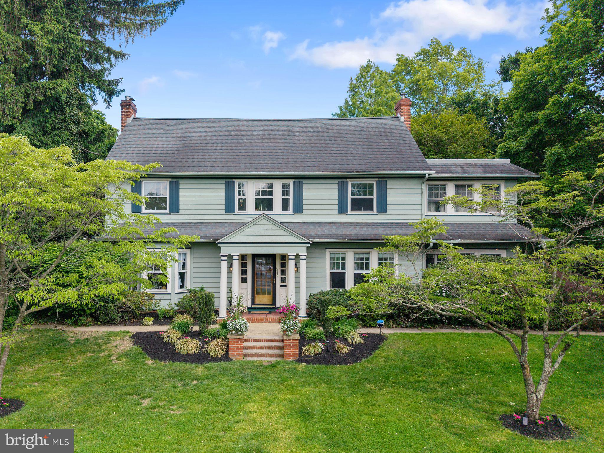 229 North Main Street Woodstown, NJ 08098 - Photo 2 of 74 a front view of a house with a yard and trees