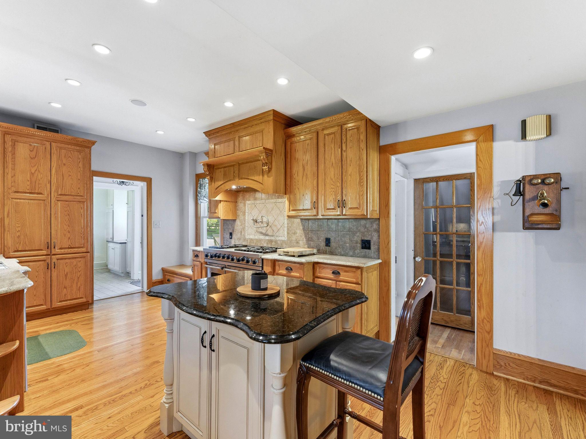 229 North Main Street Woodstown, NJ 08098 - Photo 24 of 74 a kitchen with a table chairs stove and wooden floor