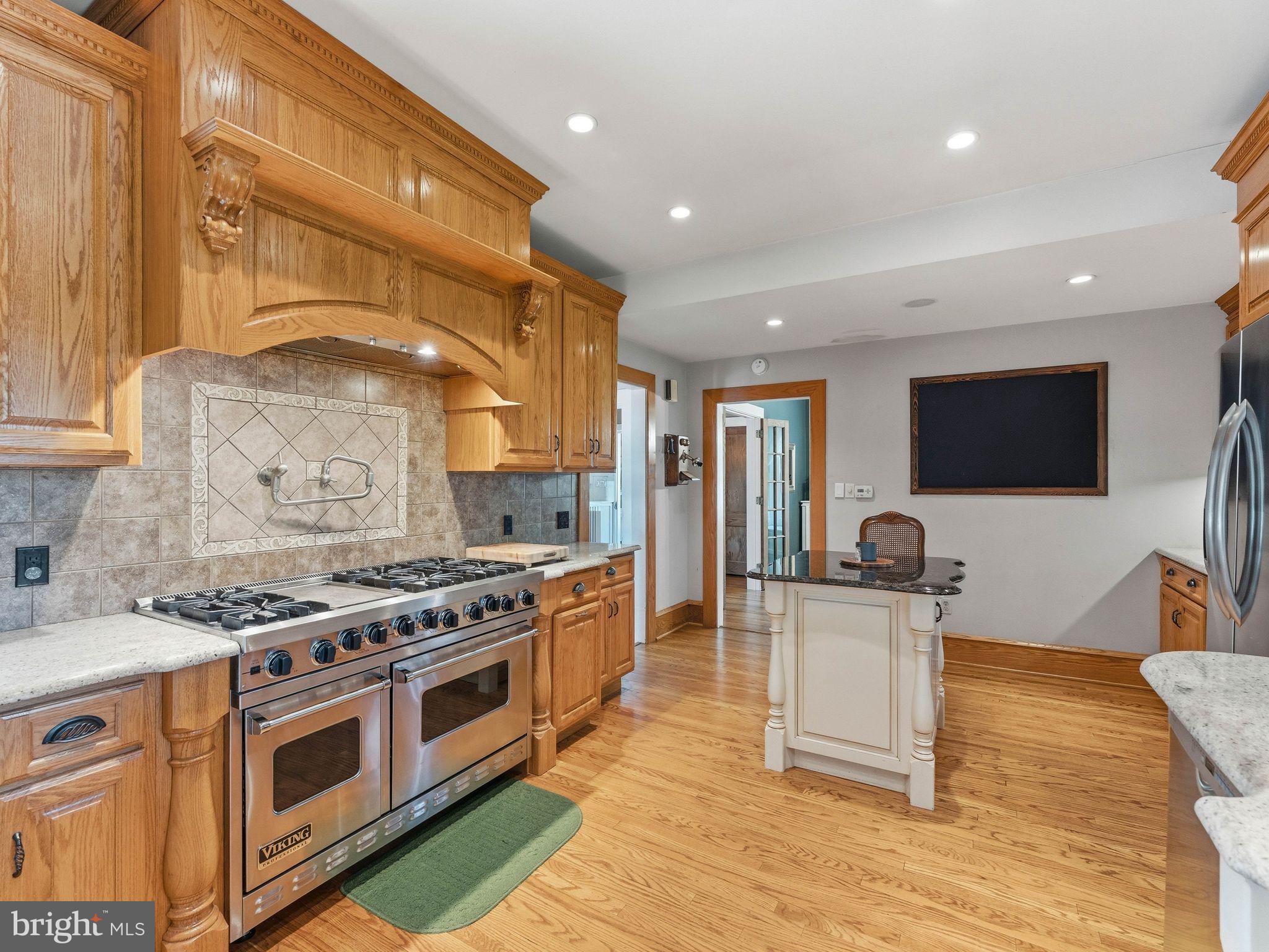 229 North Main Street Woodstown, NJ 08098 - Photo 26 of 74 a kitchen with stainless steel appliances granite countertop a stove and a sink
