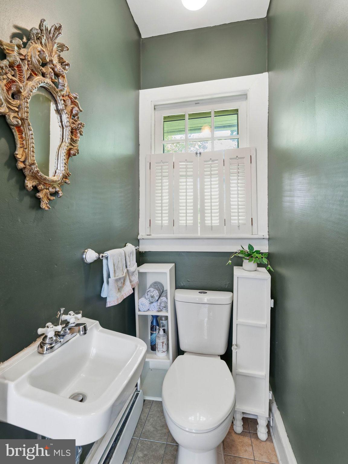 229 North Main Street Woodstown, NJ 08098 - Photo 27 of 74 a bathroom with a toilet sink and mirror