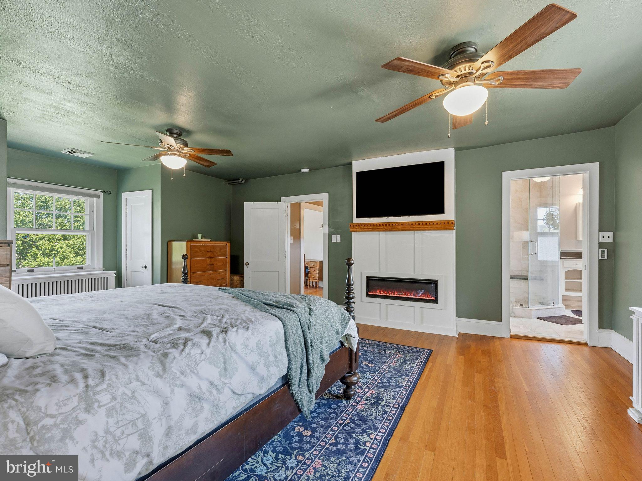 229 North Main Street Woodstown, NJ 08098 - Photo 32 of 74 a spacious bedroom with a bed and a flat screen tv
