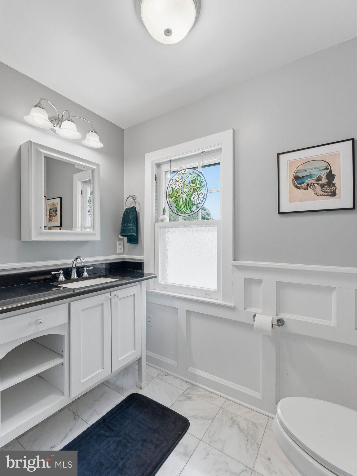 229 North Main Street Woodstown, NJ 08098 - Photo 35 of 74 a bathroom with a toilet a sink and mirror