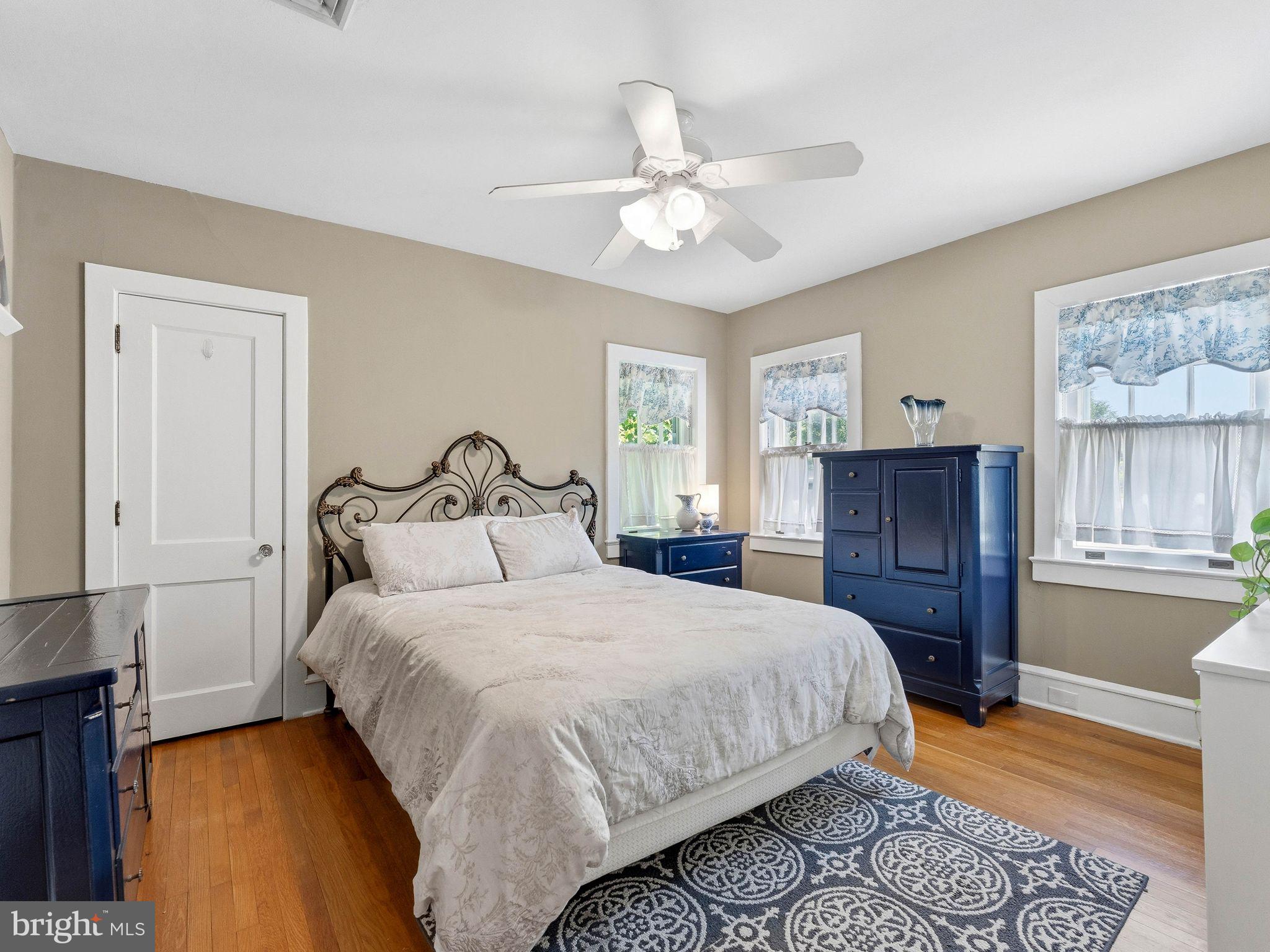229 North Main Street Woodstown, NJ 08098 - Photo 37 of 74 a bedroom with a bed and wooden floor