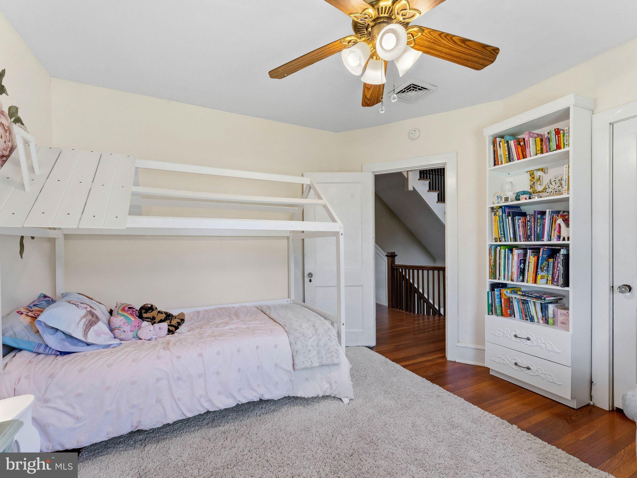 229 North Main Street Woodstown, NJ 08098 - Photo 40 of 74 a bedroom with a bed and a book shelf