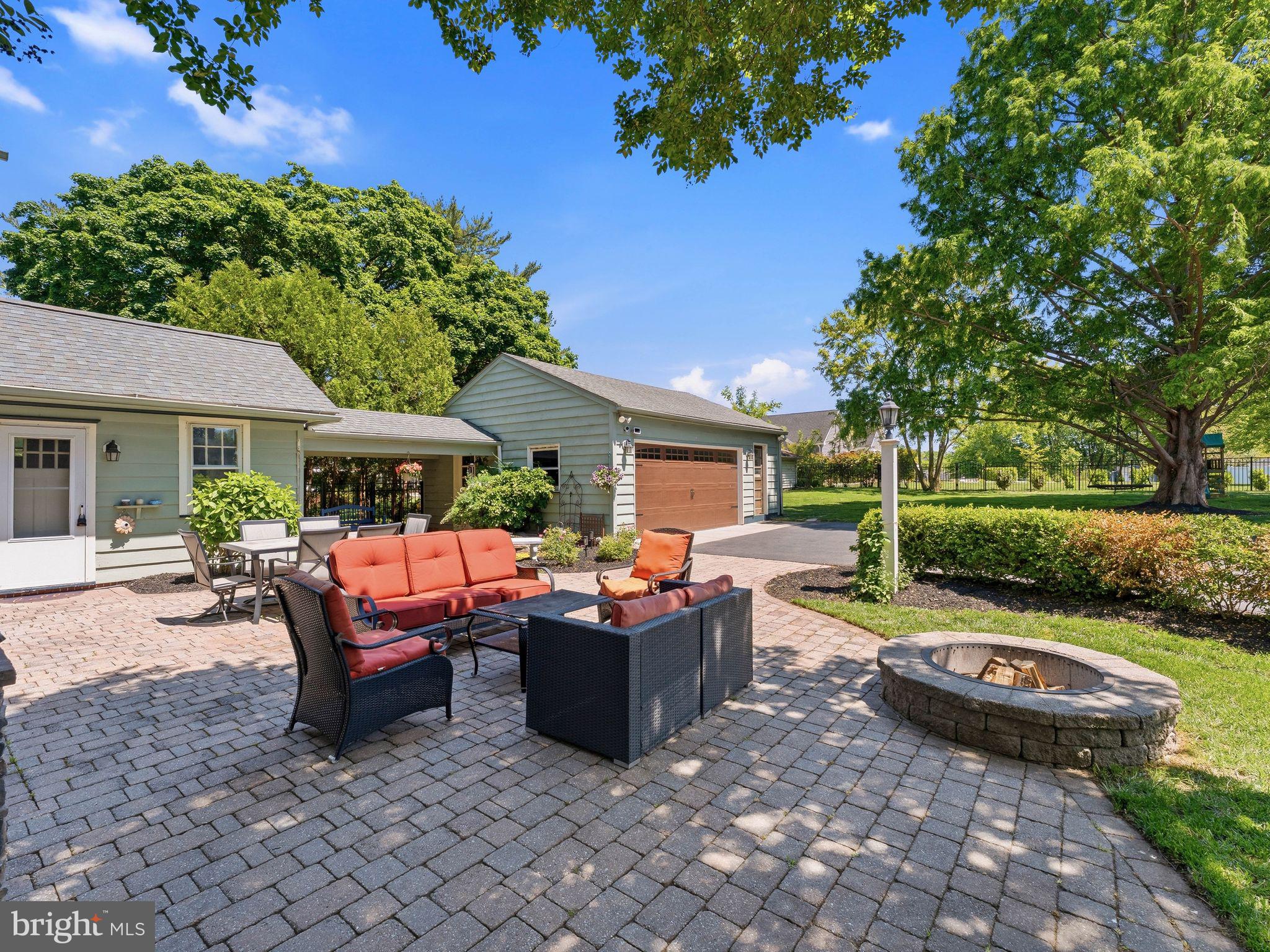 229 North Main Street Woodstown, NJ 08098 - Photo 50 of 74 a view of a patio with table and chairs potted plants and a large tree
