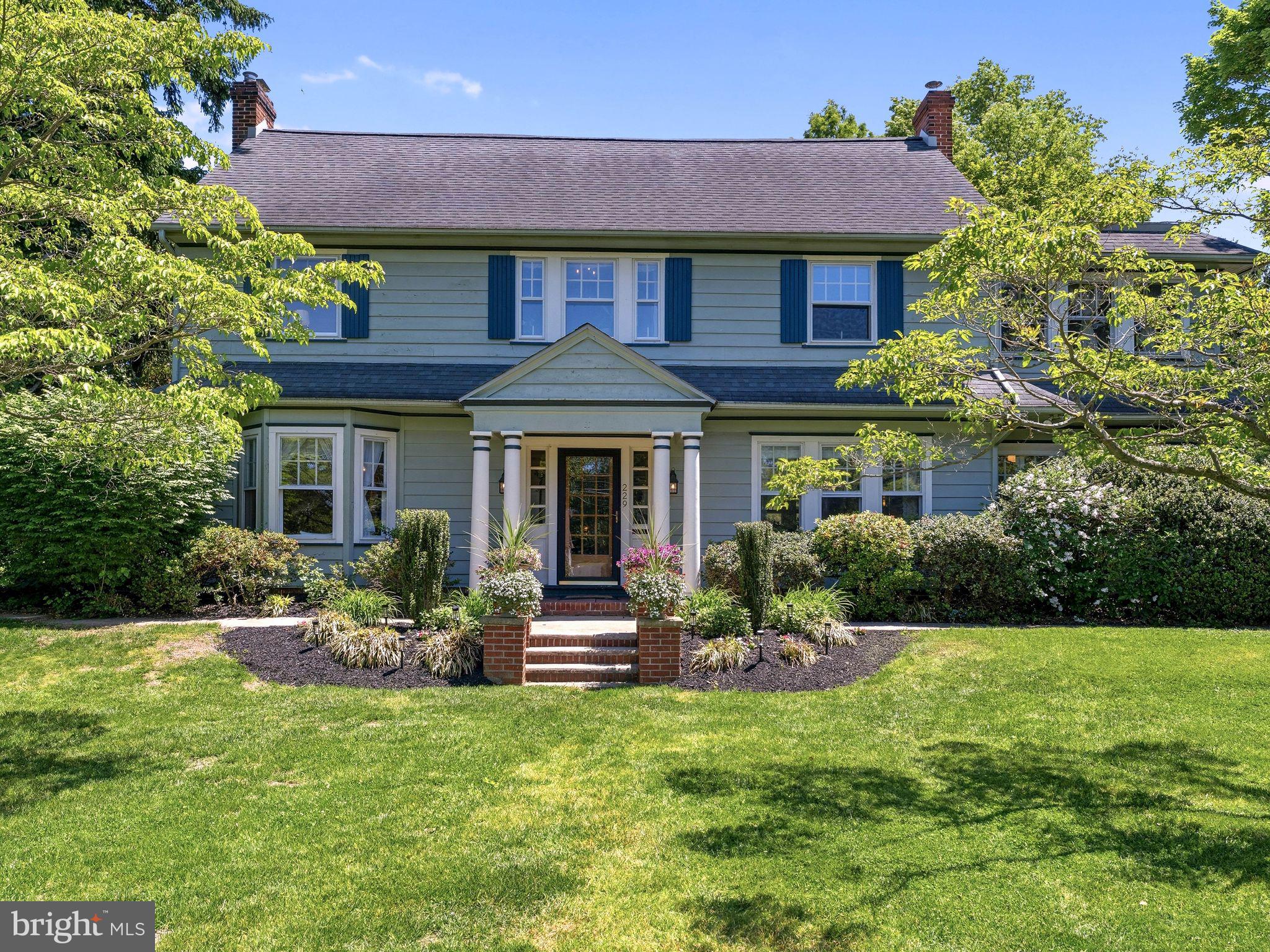 229 North Main Street Woodstown, NJ 08098 - Photo 69 of 74 a front view of a house with garden and porch