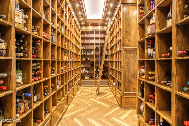 a living room with fireplace furniture and a large window