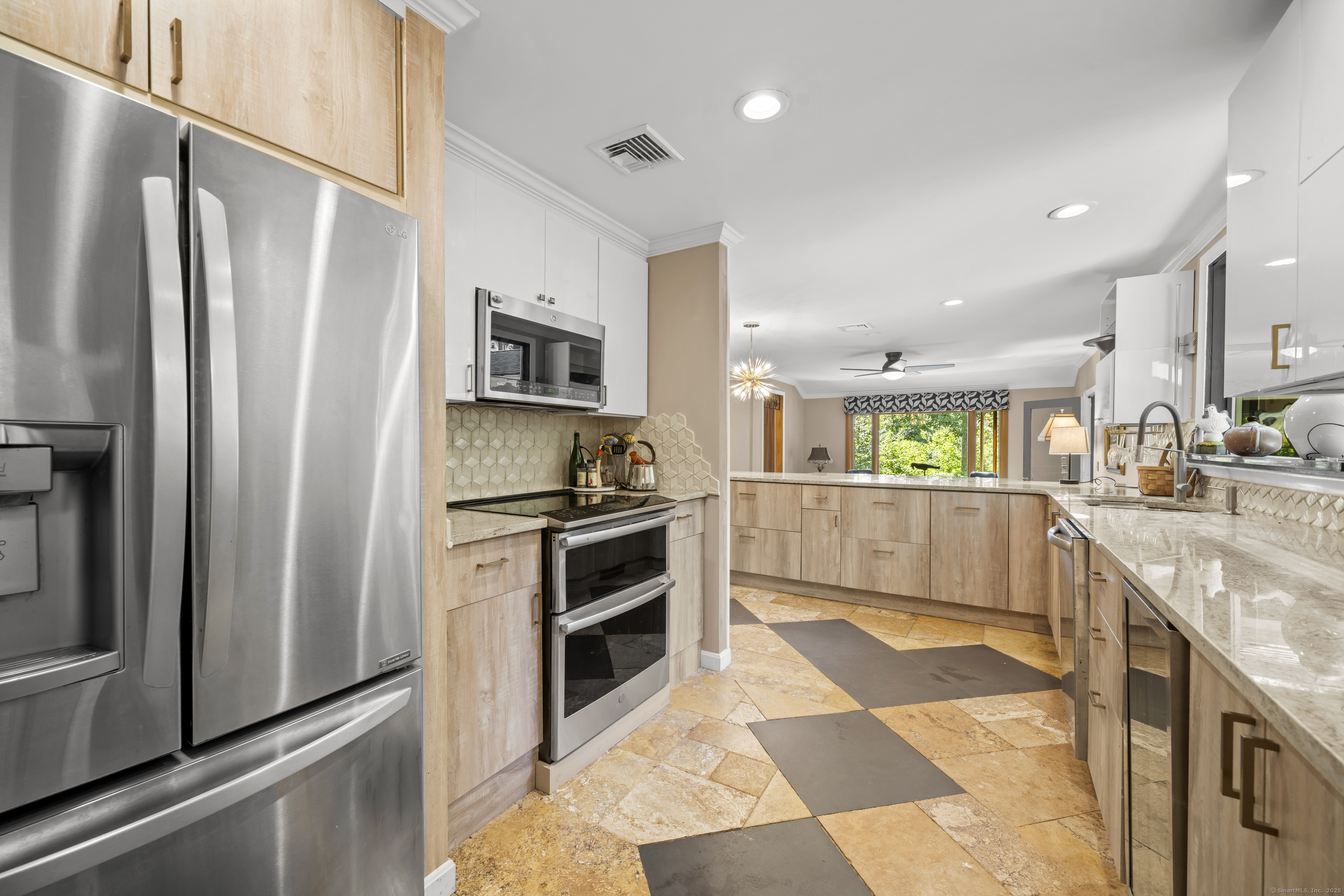 92 Kenmore Road Bloomfield, CT 06002 - Photo 13 of 38 a kitchen with stainless steel appliances granite countertop a refrigerator oven a sink and dishwasher