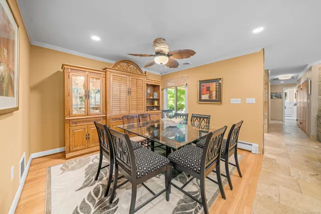 a dining room with furniture and window
