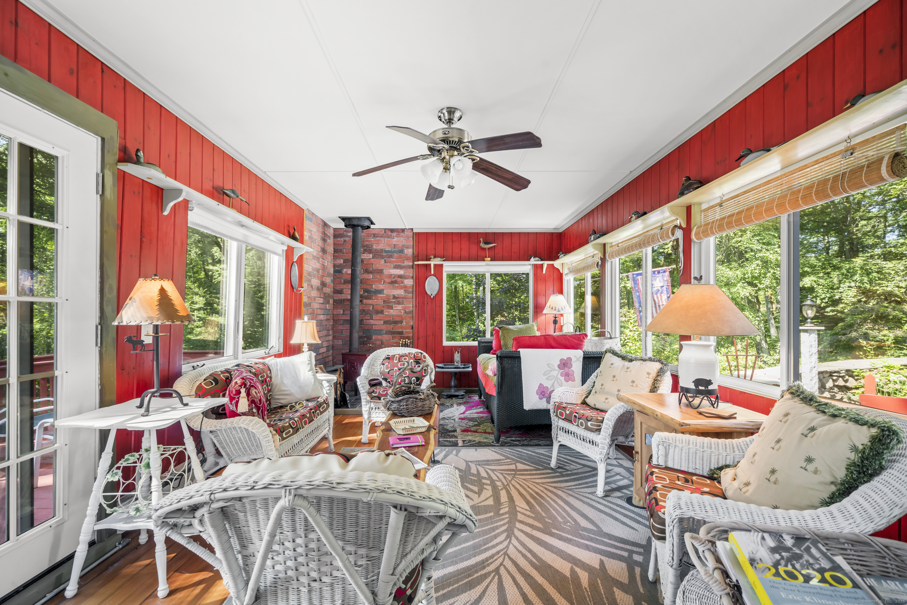 92 Kenmore Road Bloomfield, CT 06002 - Photo 15 of 38 a living room with furniture a fireplace and a large window