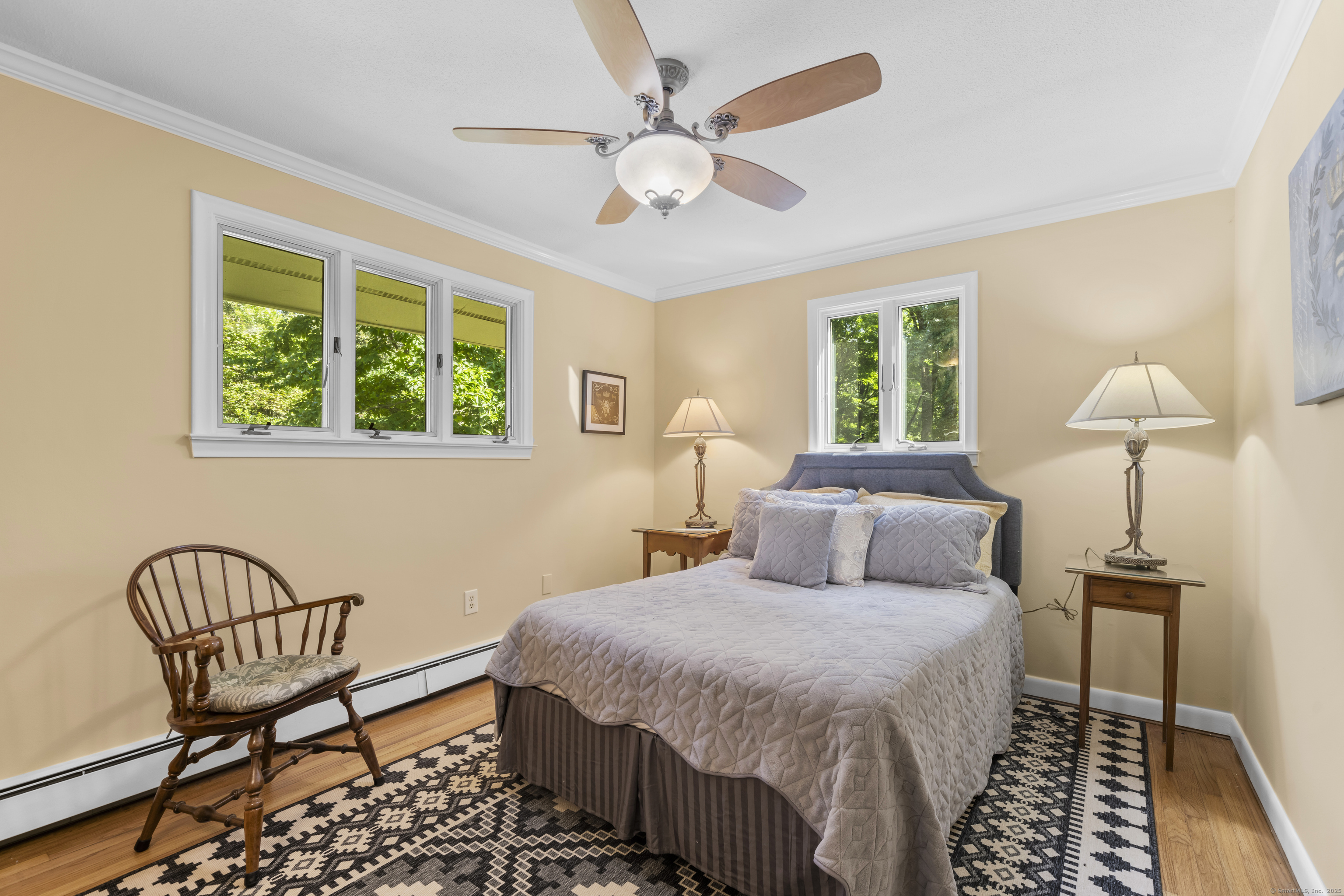 92 Kenmore Road Bloomfield, CT 06002 - Photo 18 of 38 a bedroom with a bed and a chandelier