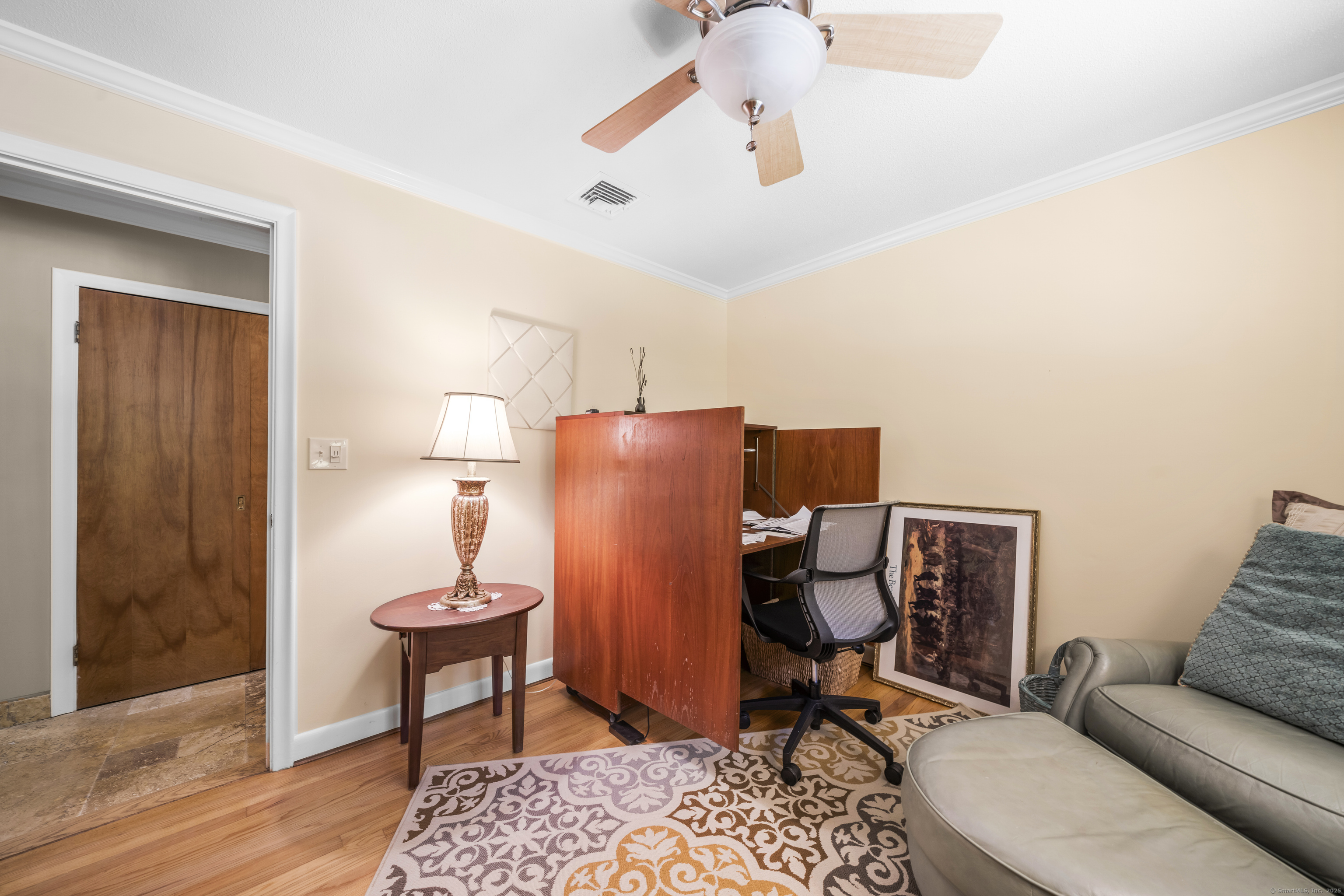92 Kenmore Road Bloomfield, CT 06002 - Photo 23 of 38 a workspace room with furniture and wooden floor