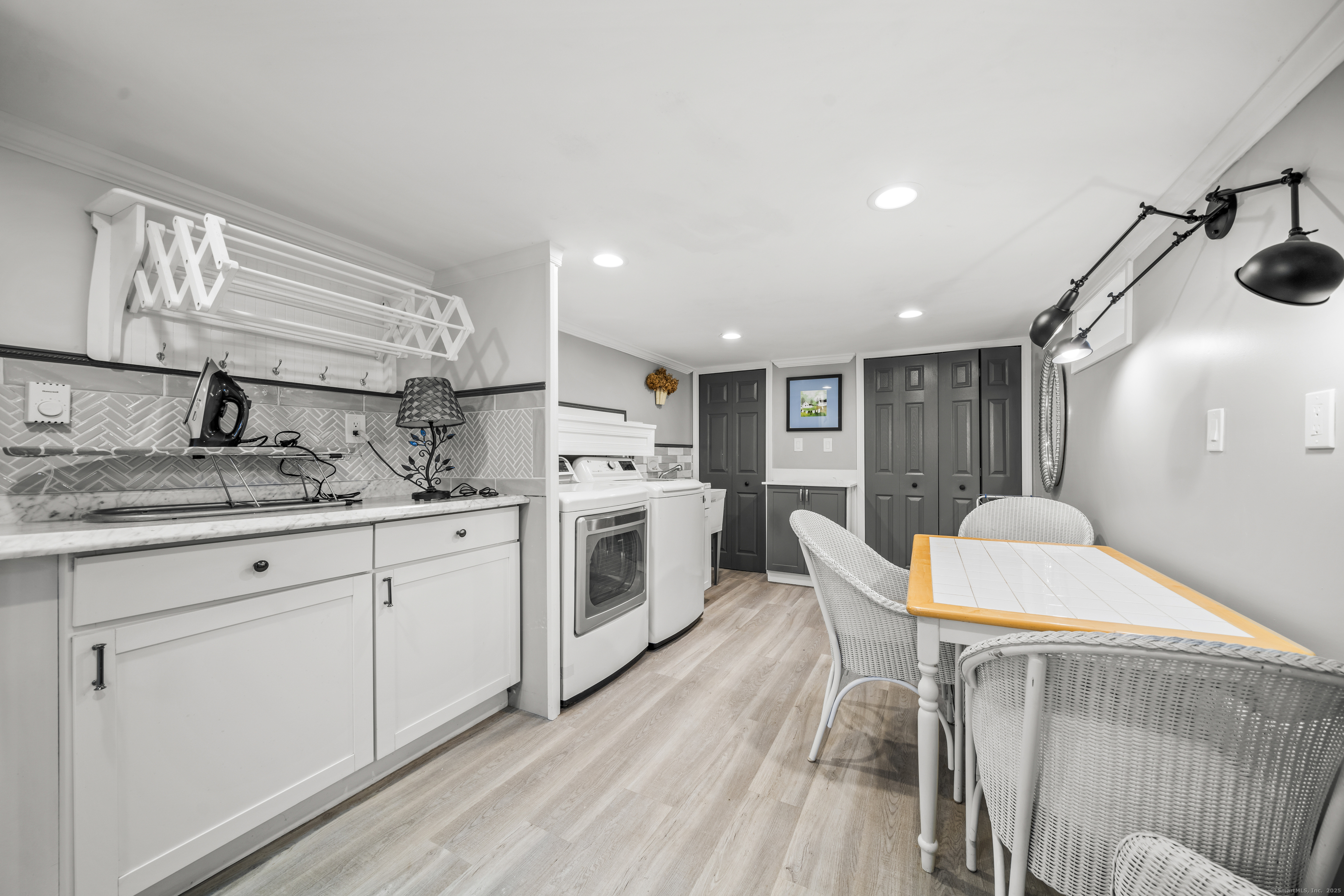 92 Kenmore Road Bloomfield, CT 06002 - Photo 26 of 38 a kitchen with furniture a sink a counter space and stainless steel appliances