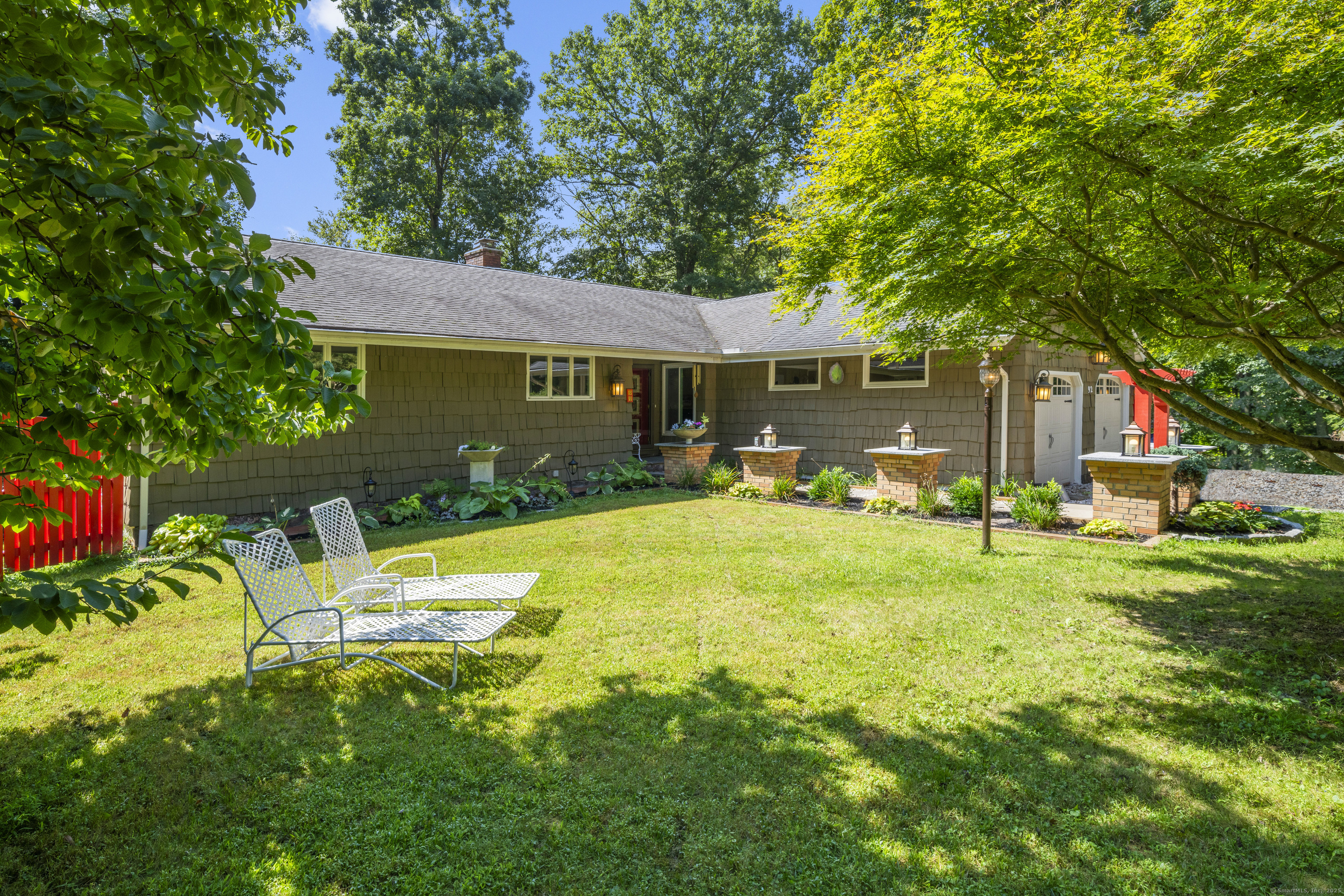 92 Kenmore Road Bloomfield, CT 06002 - Photo 27 of 38 a view of a house with pool and a garden
