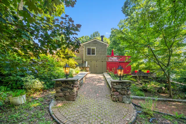 a front view of a house with yard