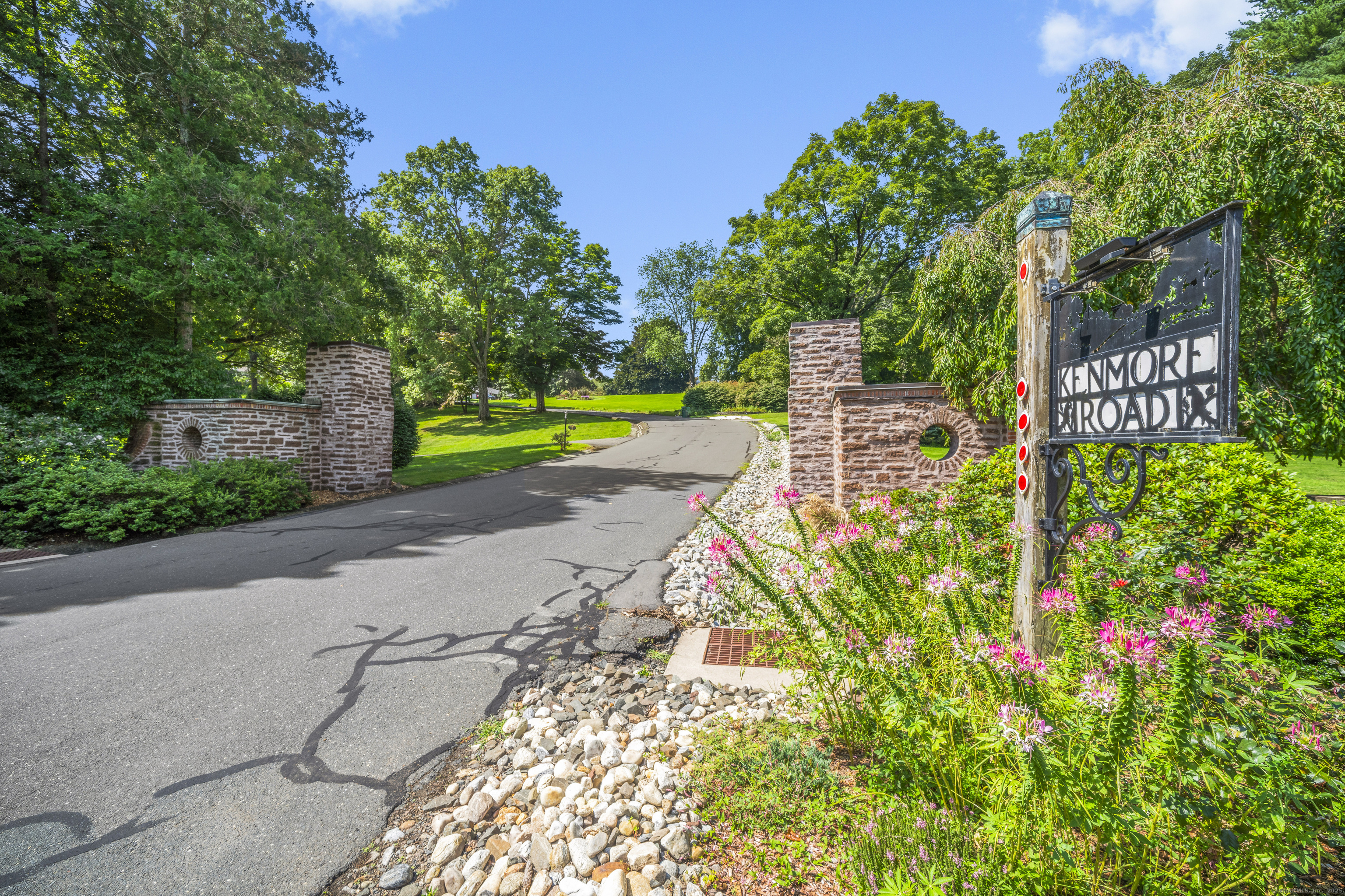 92 Kenmore Road Bloomfield, CT 06002 - Photo 33 of 38 a view of a street with potted plants and large trees