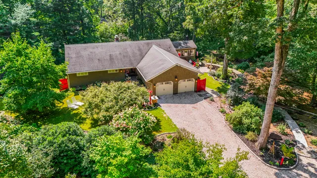front view of a house with a tree