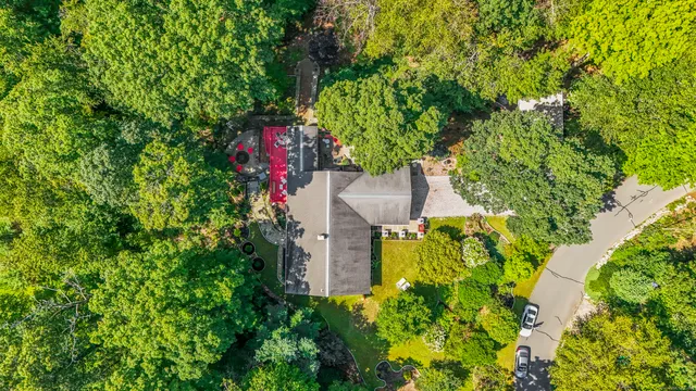 a picture of a room with a white wall and a refrigerator