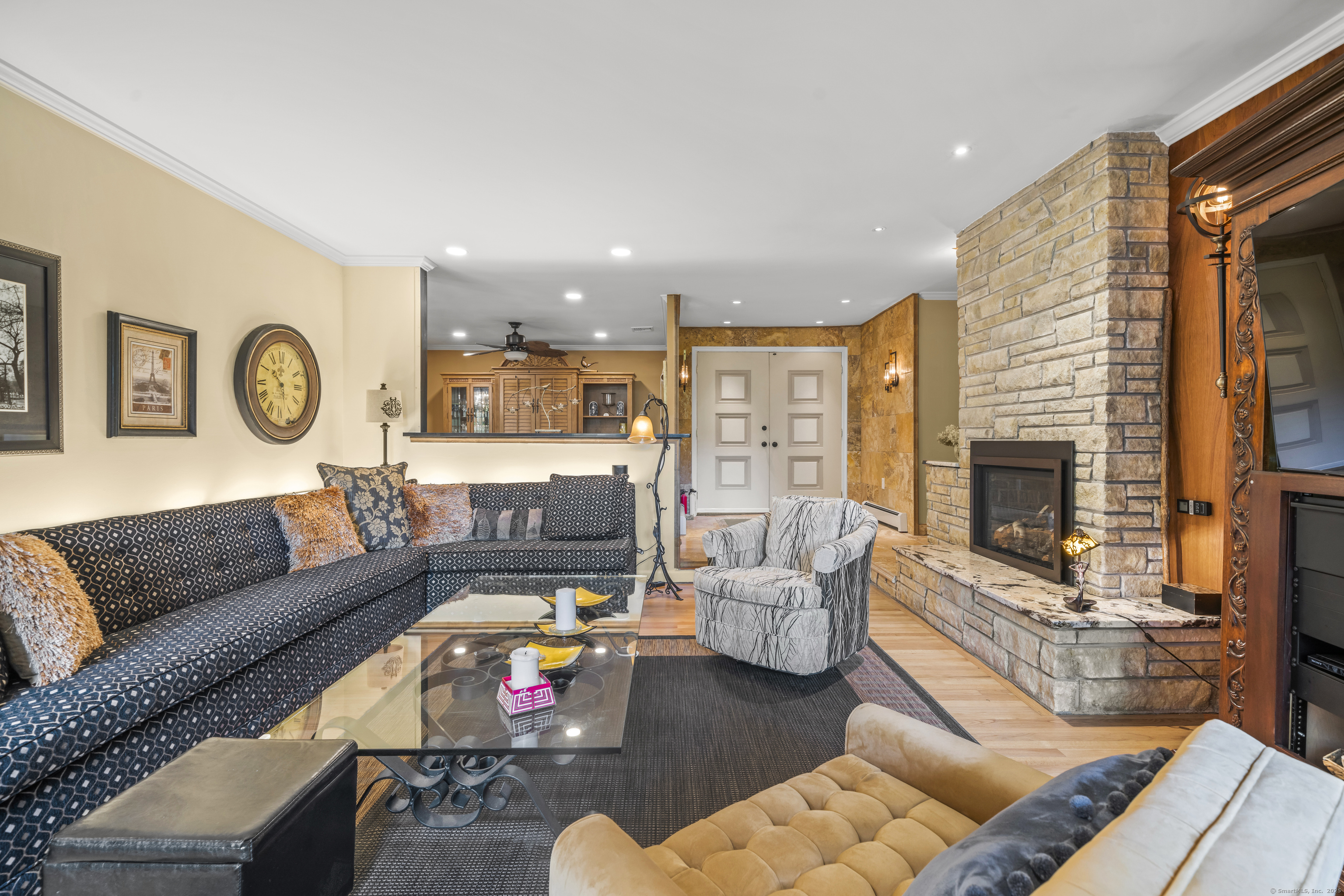 92 Kenmore Road Bloomfield, CT 06002 - Photo 4 of 38 a living room with furniture and a fireplace