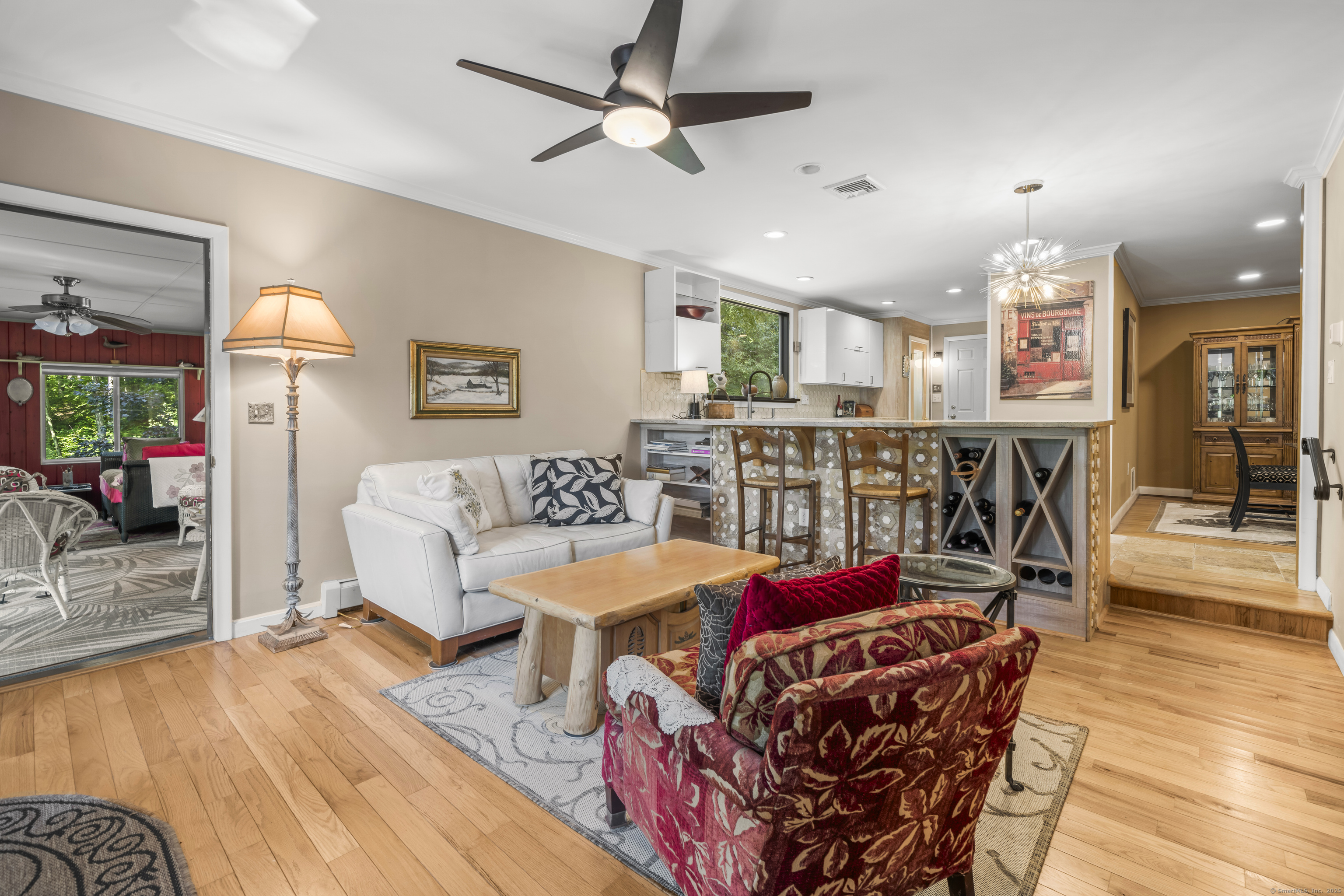 92 Kenmore Road Bloomfield, CT 06002 - Photo 9 of 38 a living room with furniture a ceiling fan and a rug