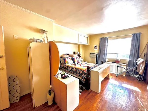 a view of a livingroom with furniture and a window