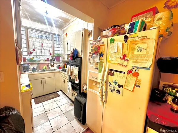 a kitchen with a sink appliances and cabinets