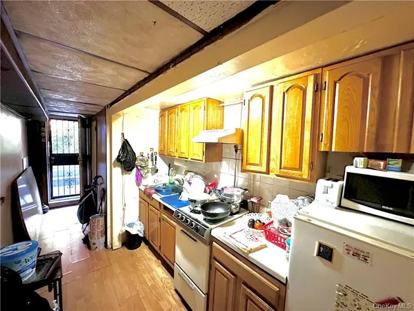 a kitchen with a sink and appliances