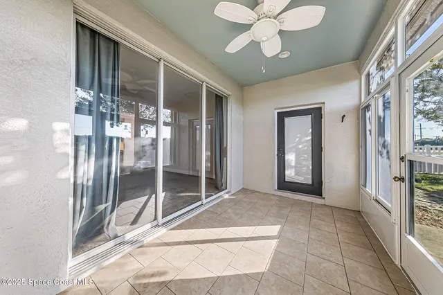 a view of a hallway with windows