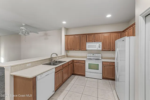 a kitchen with a sink stove and refrigerator
