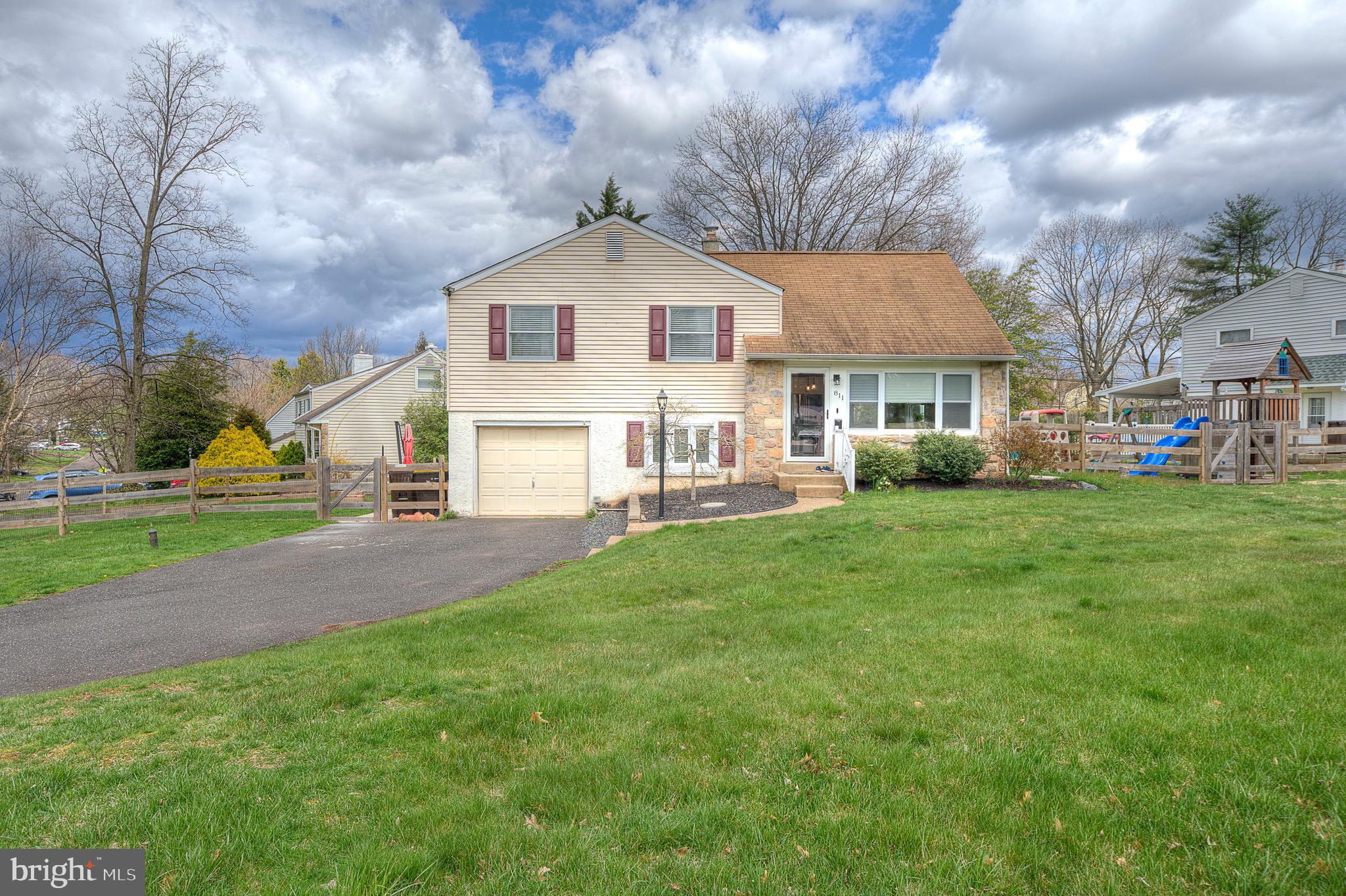 811 Woodlawn Drive Lansdale, PA 19446 - Photo 1 of 28 a front view of a house with a yard and trees