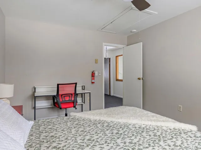 a bathroom with a sink and mirror with toilet