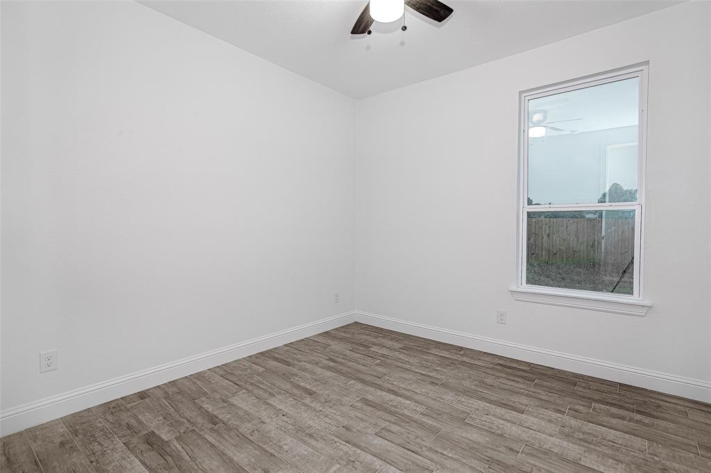 204 High Rdg Court Godley, TX 76044 - Photo 13 of 28 wooden floor in an empty room