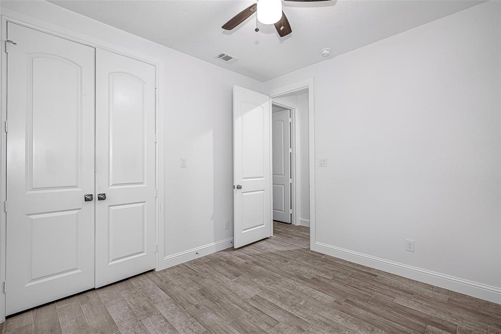 204 High Rdg Court Godley, TX 76044 - Photo 14 of 28 wooden floor in an empty room