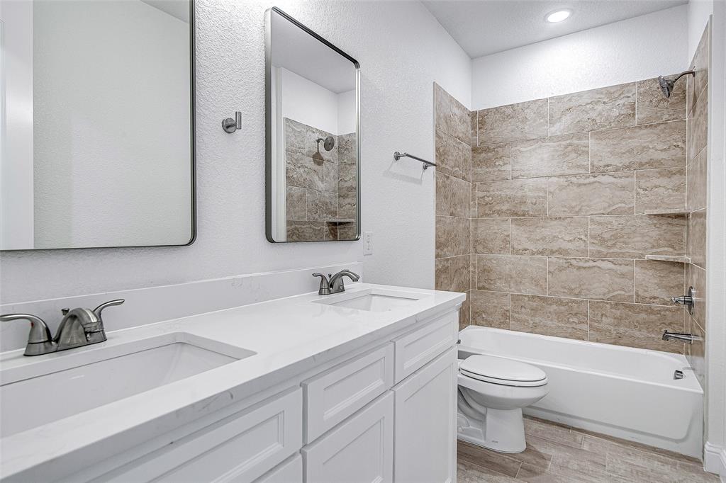 204 High Rdg Court Godley, TX 76044 - Photo 17 of 28 a bathroom with a sink a toilet and shower