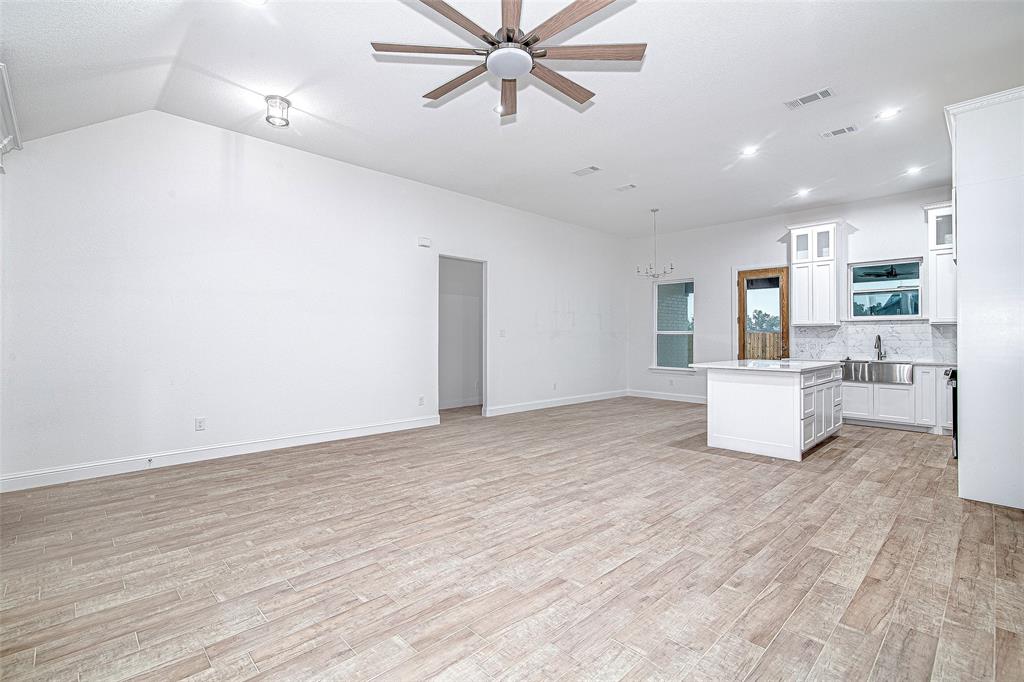 204 High Rdg Court Godley, TX 76044 - Photo 27 of 28 a view of a kitchen with a sink and a window