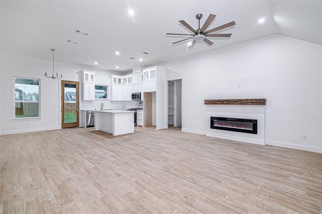 204 High Rdg Court Godley, TX 76044 - Photo 28 of 28 a view of a kitchen with a sink and a stove top oven