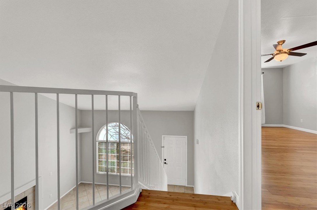 10148 Tree Bark Street Las Vegas, NV 89183 - Photo 25 of 37 A well-lit entry with a distinctive arched window welcomes residents and guests.