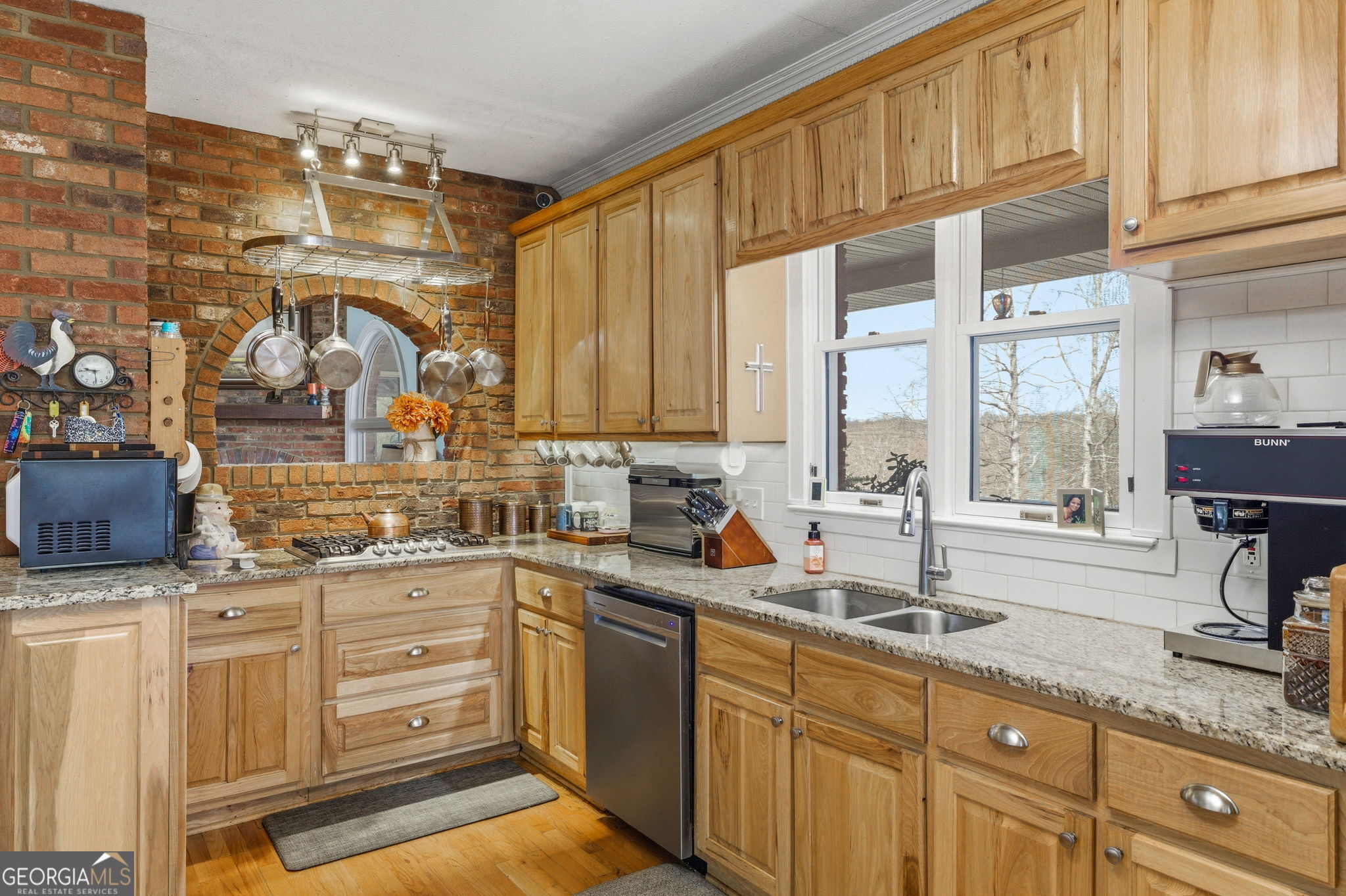 401 Herrin Road Cornelia, GA 30531 - Photo 15 of 83 a kitchen with stainless steel appliances kitchen island granite countertop a sink and cabinets