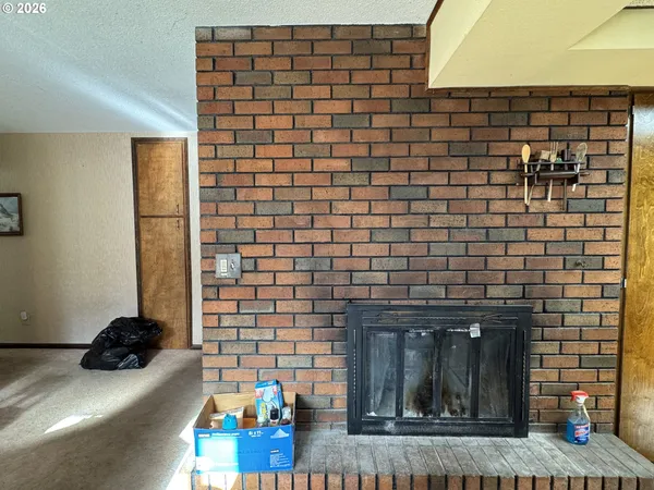 a kitchen with stainless steel appliances granite countertop a sink a stove counter space and cabinets