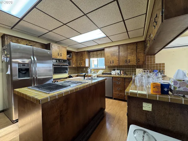 a living room with lots of furniture and a book shelf
