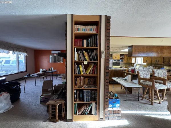 a living room with furniture and a mirror