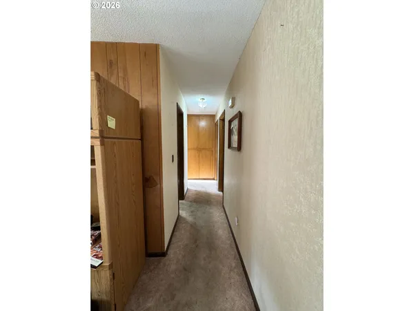 a bedroom with a large bed and a large window