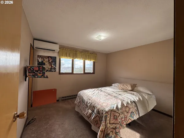 a room with furniture bookshelf and a window
