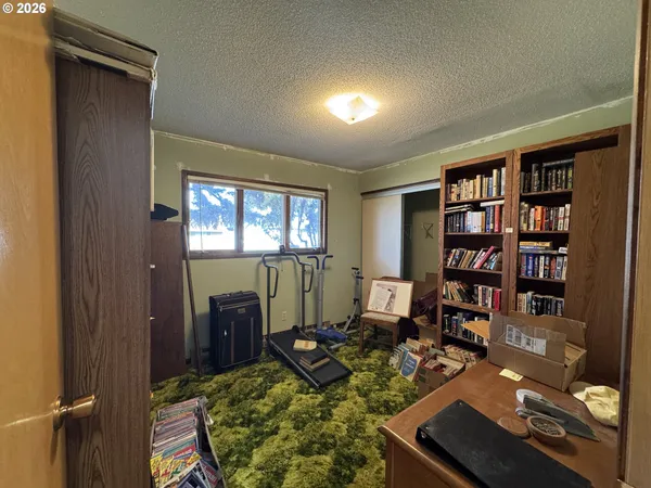 a hallway with a large mirror and a sink