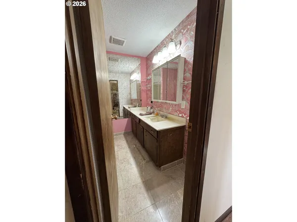 a bathroom with a glass shower door