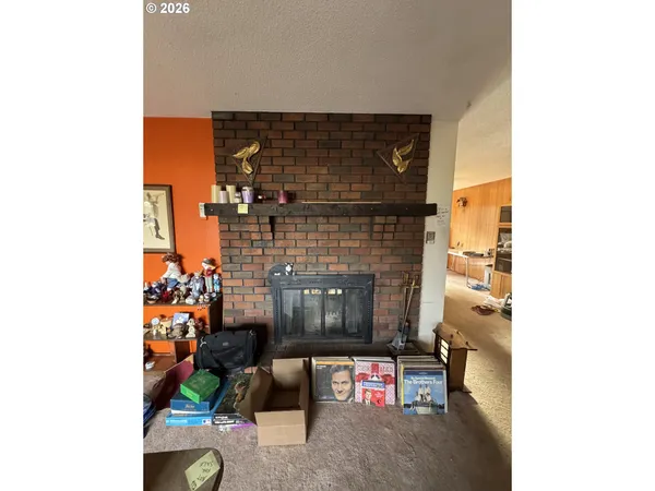 a view of a livingroom with furniture and a fireplace